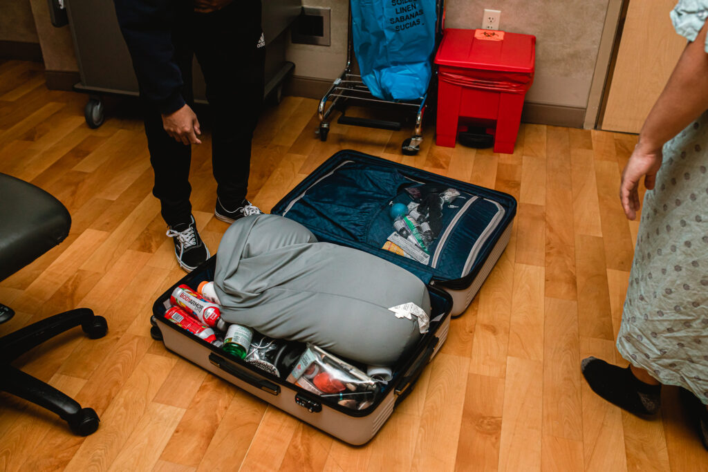 Hospital birth bag packed and ready during early labor, photographed by a Fort Worth birth photographer.