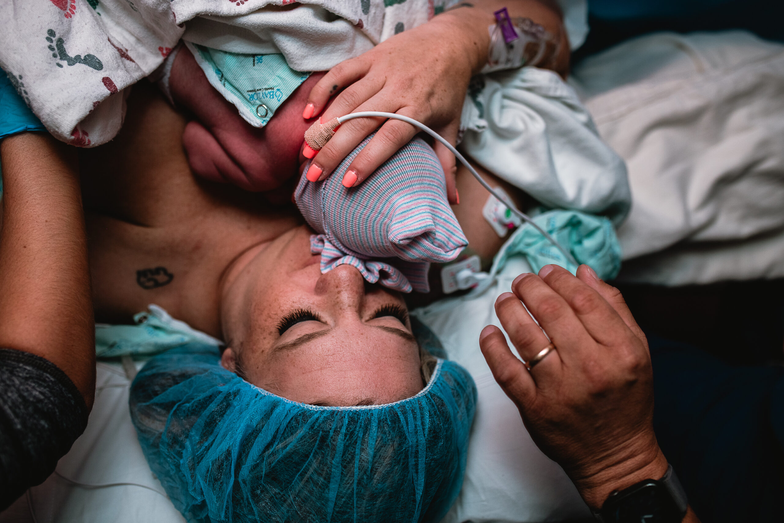 Mother holding her newborn after a C-section birth in Fort Worth, a gentle and emotional moment documented by a DFW birth photographer.