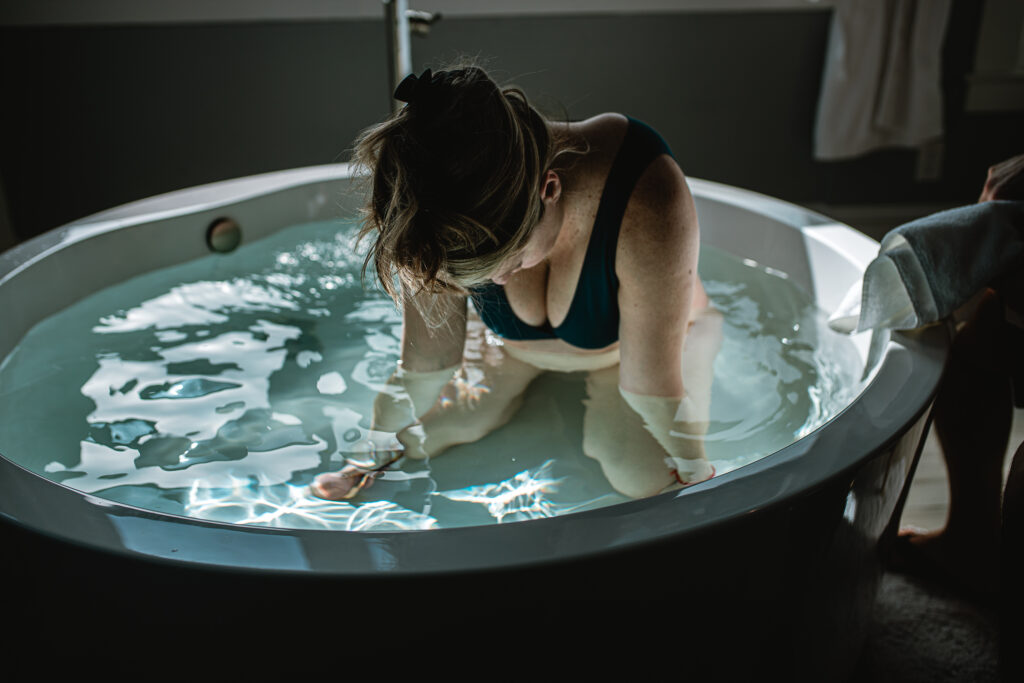 Mother laboring peacefully at home during a Fort Worth home birth, captured by a documentary birth photographer in DFW.
