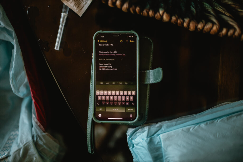 Phone screen displaying a supportive labor playlist and encouraging messages