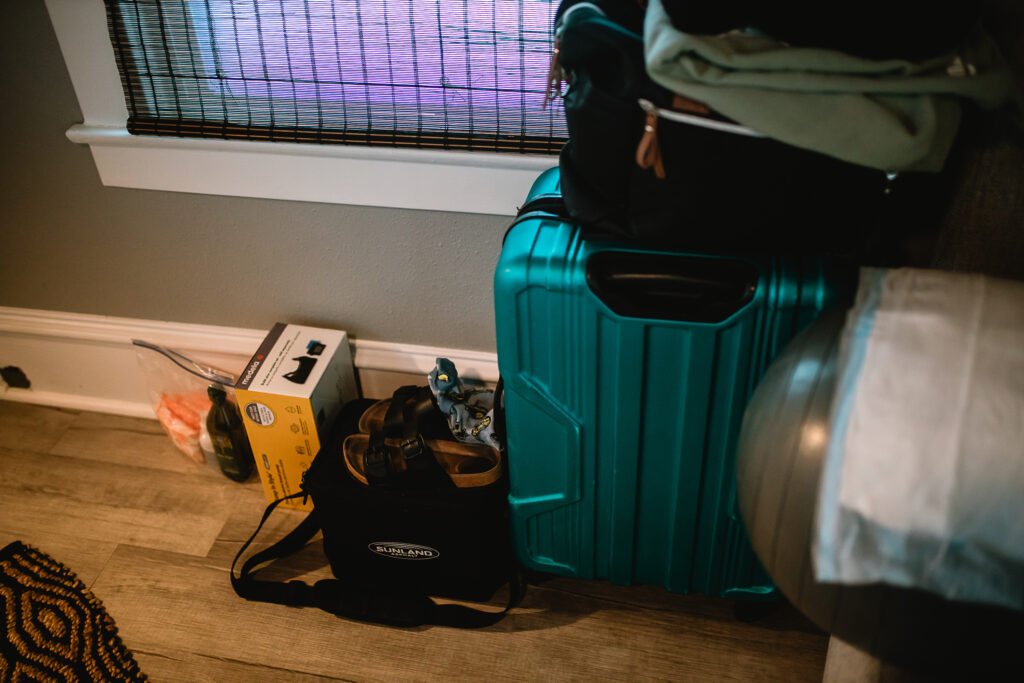 birth center bag and baby items lined up on the floor as they prepare for the final stage of labor
