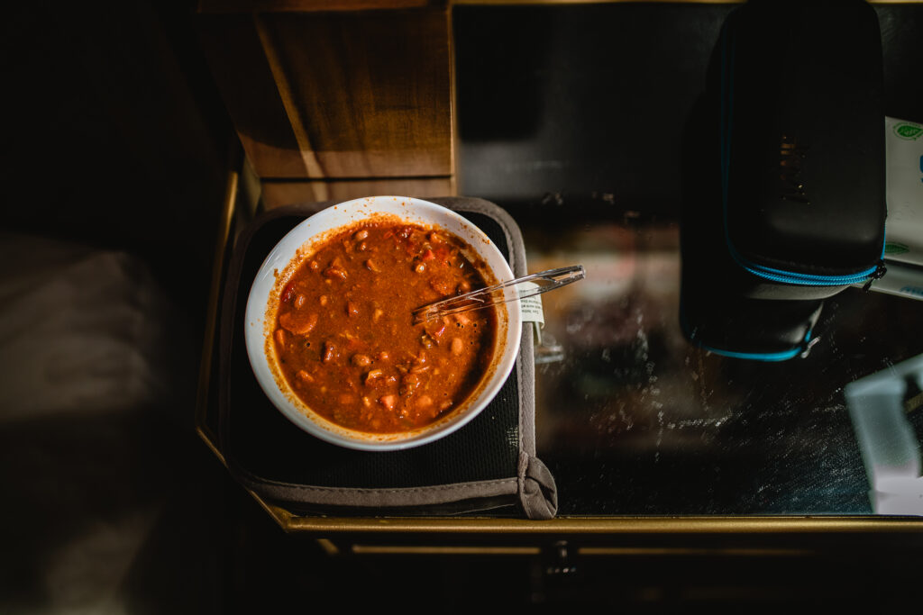Hot meal in a small bowl on the bedside table, prepared for the mother after birth
