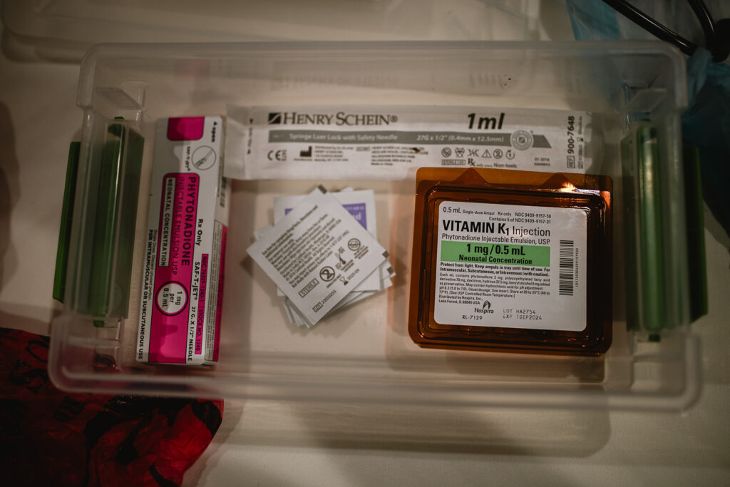 Close-up of newborn exam kit and supplies laid out neatly on the table