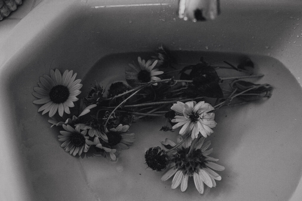 Sunflowers floating in bathtub as part of peaceful home birth environment