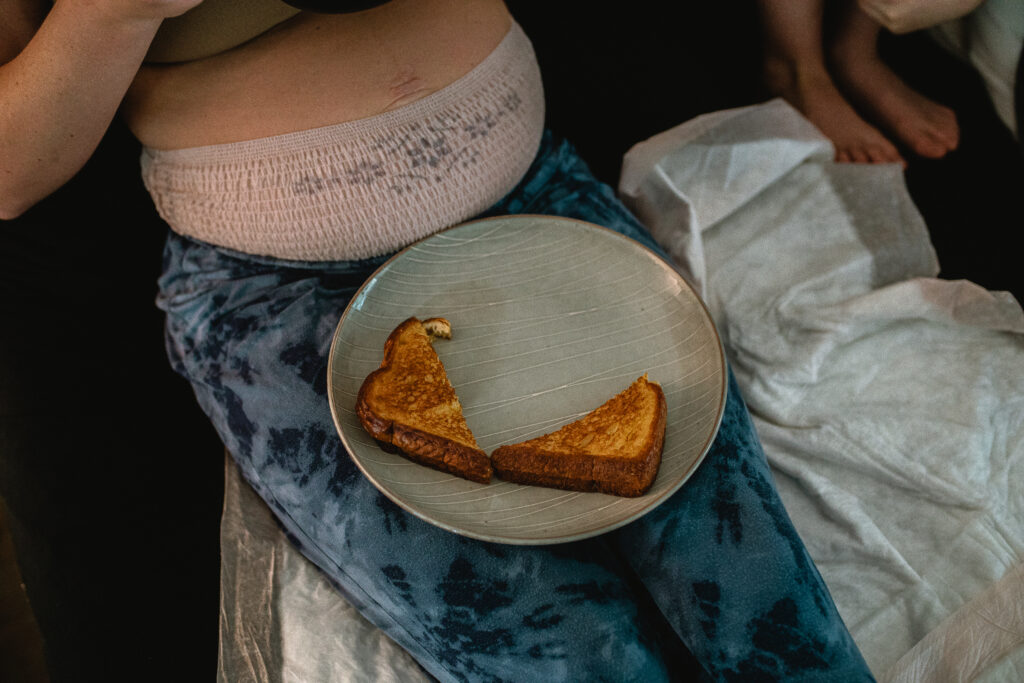 Postpartum recovery snack on bedside plate during quiet moments after home birth