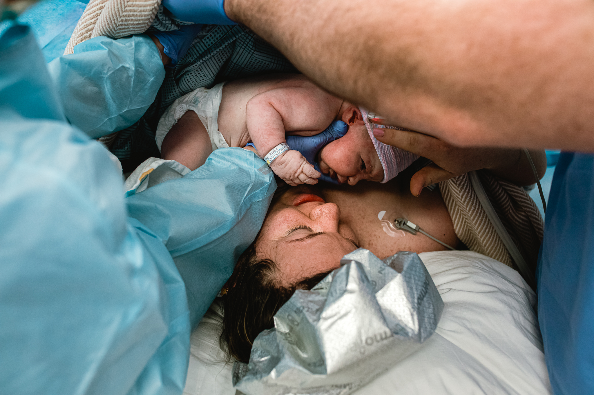 Quiet emotional recovery moment after birth in DFW, captured in a documentary birth photography style.
