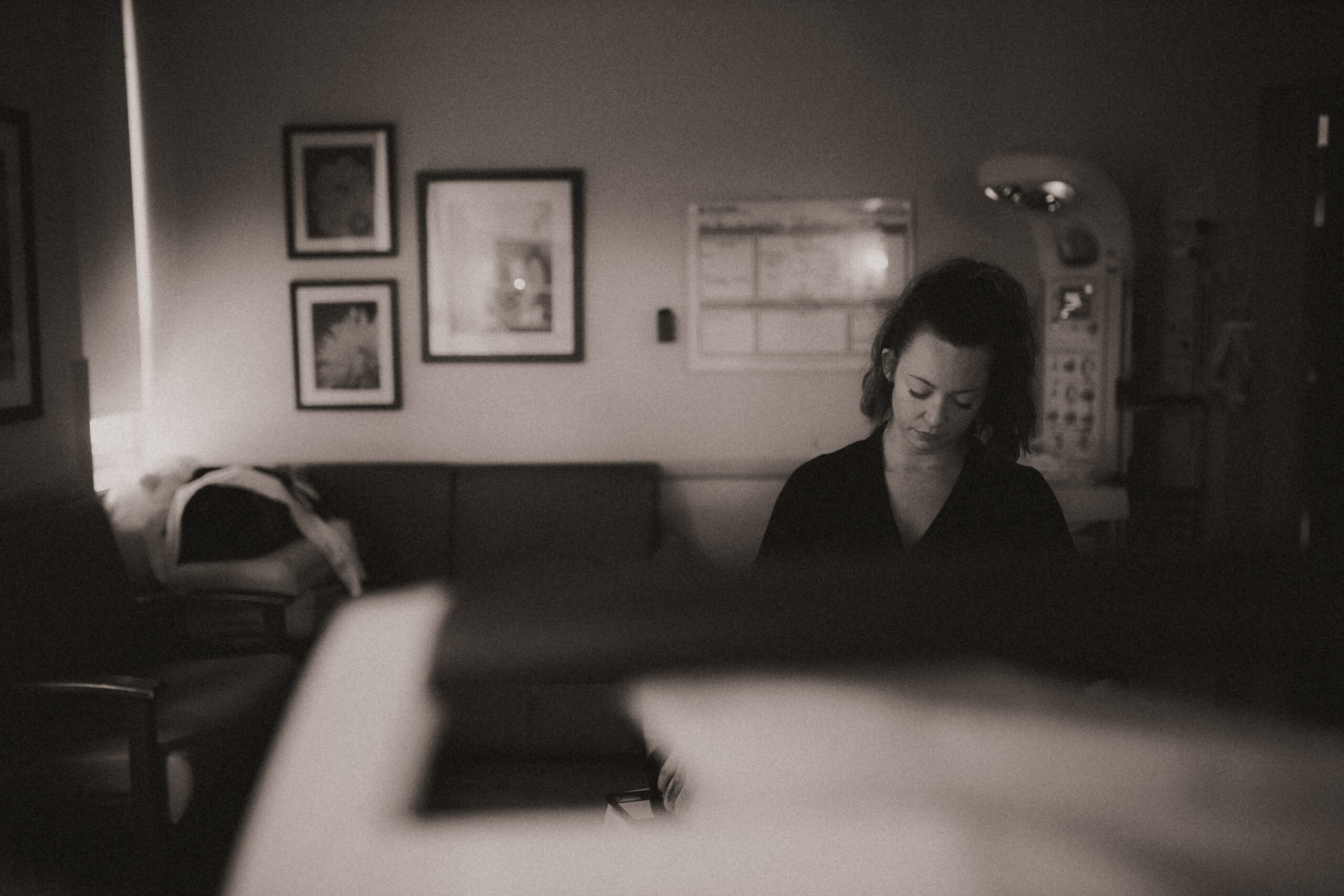 Mother laboring with support at Texas Health Harris Methodist Hospital Fort Worth during a documentary birth photography session.