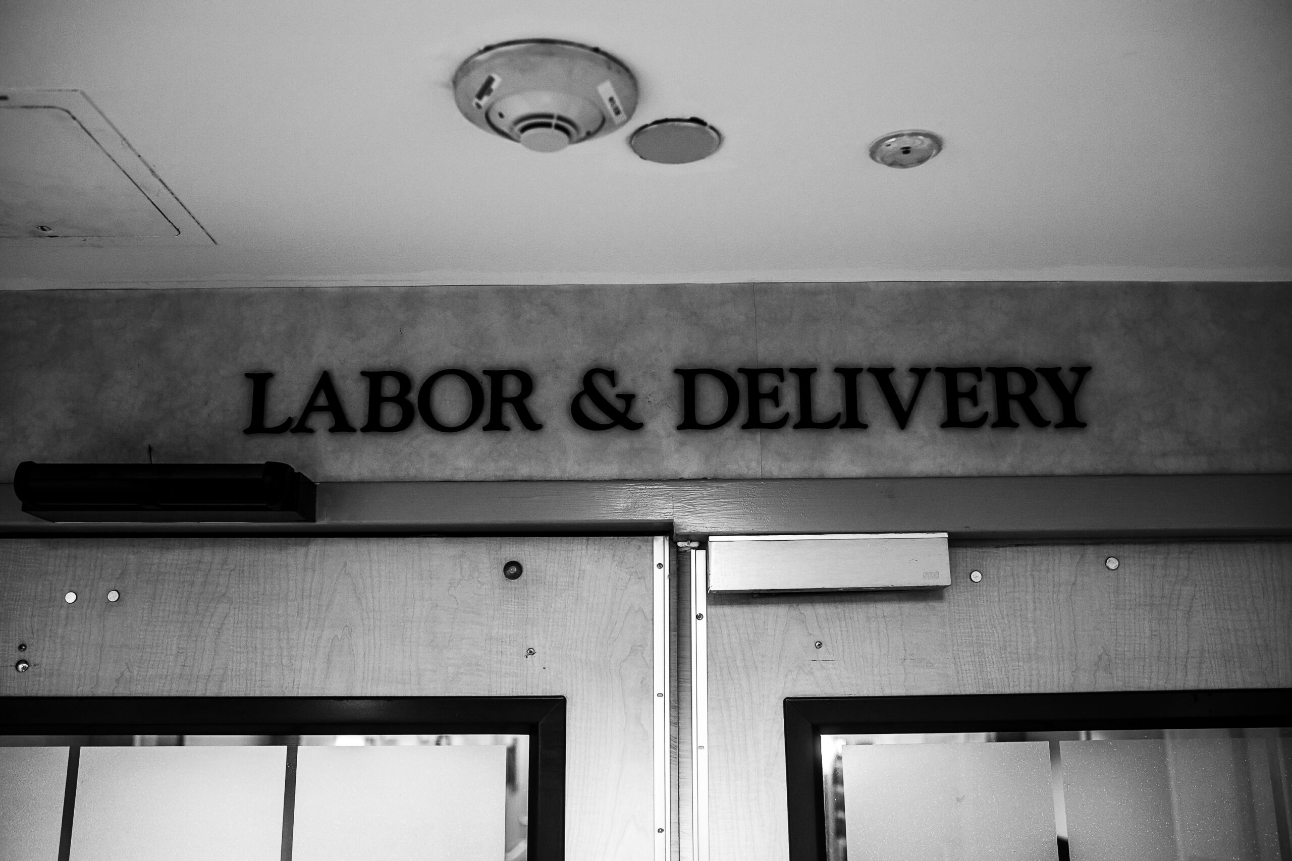 Mother laboring with support from her partner during a midwife-assisted hospital birth at Baylor University Medical Center Dallas.