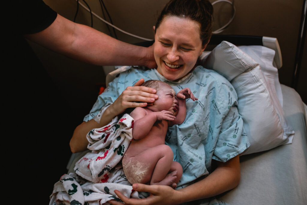 Parents sharing an emotional moment together during labor before meeting their baby.